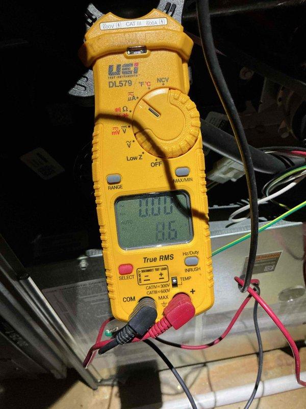 Performed a tune-up on the basement furnace, including inspection and cleaning of the flame sensor and removal and servicing of the igniter assembly. Verified electrical operation with a digital clamp meter, checking amperage draw and control circuit readings to confirm proper function of the unit. Reassembled all components and confirmed the furnace was operating correctly at completion.