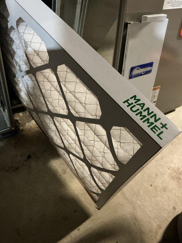 Performed a seasonal tune-up on one 9-year-old gas furnace, including inspection of the unit and verification of operation in heat mode. Inspected the return air filter and confirmed proper airflow components. Verified thermostat communication and operation, noting a wireless signal fault indicator and cracking in the wall surface around the thermostat mounting.