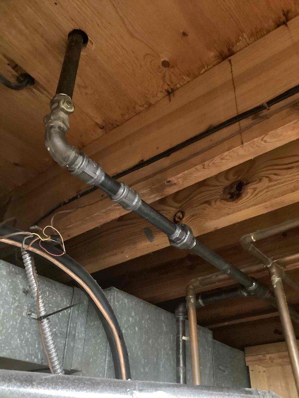 Responded to a reported gas shut-off at the furnace due to a suspected failed gas valve and inspected the unit and associated black iron gas piping, shutoff valves, and flexible gas connector for leaks, corrosion, and proper connections. Documented the condition of the gas supply piping and valve assembly serving the system, and verified the supply was secured and safe at the time of service.