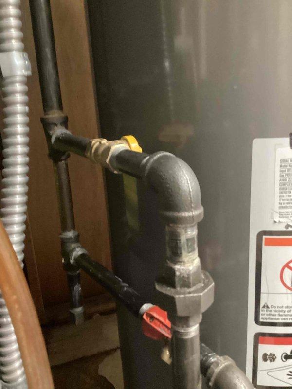 Responded to a reported gas shut-off at the furnace due to a suspected failed gas valve and inspected the unit and associated black iron gas piping, shutoff valves, and flexible gas connector for leaks, corrosion, and proper connections. Documented the condition of the gas supply piping and valve assembly serving the system, and verified the supply was secured and safe at the time of service.