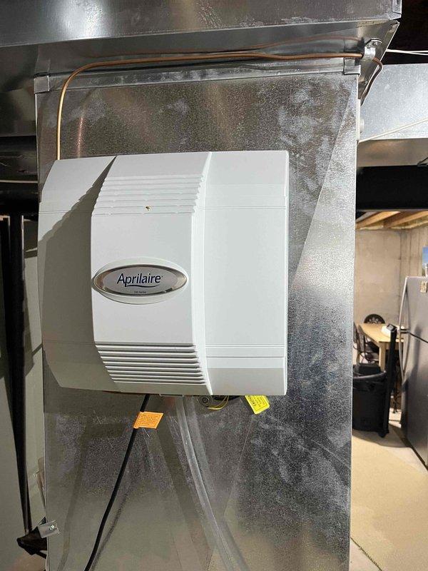 Performed annual heating tune-up on two gas furnace systems, including inspection of the burner assembly, heat exchanger, ignition components, electrical connections, and safety controls, along with verification of proper combustion, airflow, and thermostat operation. Inspected the condensate drain piping and the Aprilaire whole-home humidifier, finding no visible damage, and noted residue staining on the floor near the condensate drain that should be monitored for leaks. Both systems were operating properly at completion.
