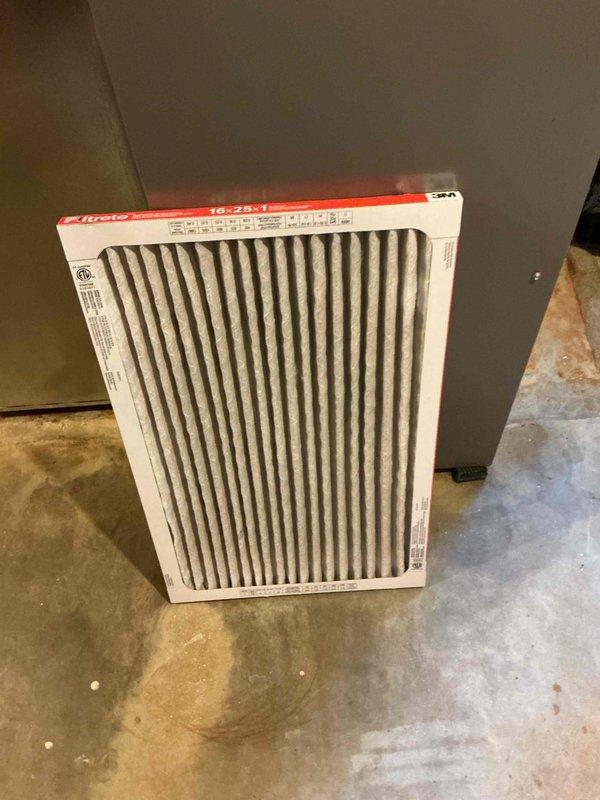 Performed a heating tune-up on the system, including inspection of the 16x25x1 return air filter, which was heavily loaded with dust and debris and clogged, restricting airflow. Inspected the bypass whole-house humidifier and found the evaporator pad aged with mineral buildup, indicating it needs replacement; confirmed the water supply line, drain tube, and seasonal damper positioning (summer/winter) are in place. Completed the system inspection and renewed the service membership.
