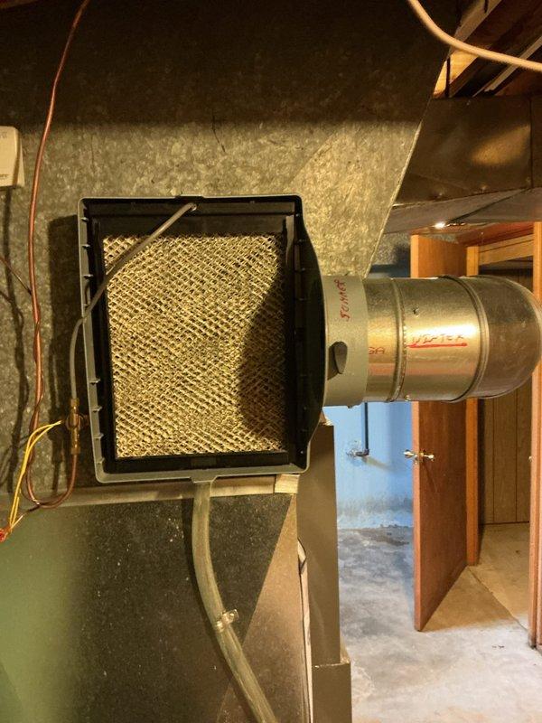 Performed a heating tune-up on the system, including inspection of the 16x25x1 return air filter, which was heavily loaded with dust and debris and clogged, restricting airflow. Inspected the bypass whole-house humidifier and found the evaporator pad aged with mineral buildup, indicating it needs replacement; confirmed the water supply line, drain tube, and seasonal damper positioning (summer/winter) are in place. Completed the system inspection and renewed the service membership.