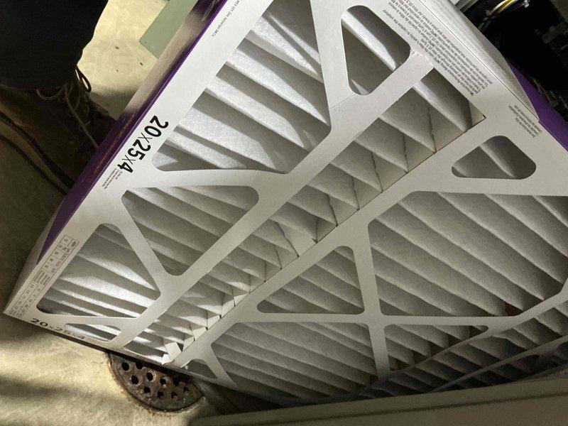 Performed seasonal heating maintenance on the furnace and replaced the 20x25x4 pleated air filter with a new one. Inspected the Aprilaire whole-home humidifier mounted on the supply duct, verifying the duct connection, wiring, water supply tubing, and drain line were intact and free of leaks, cracking, or corrosion. System left operational with no deficiencies noted.