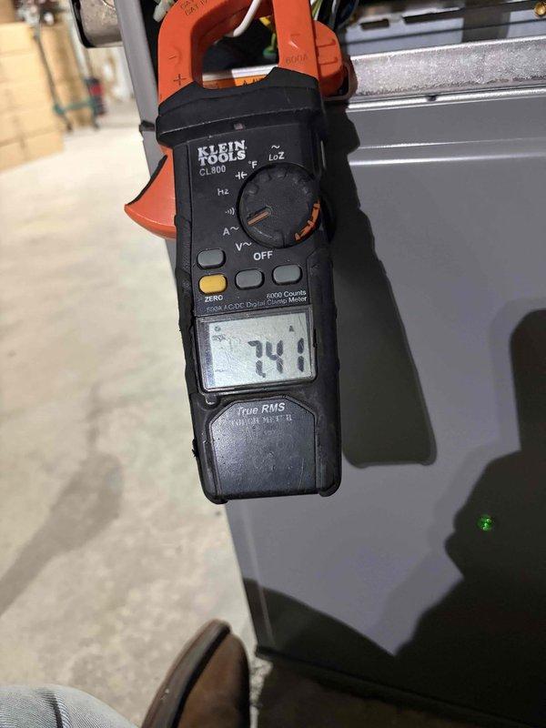 Performed a heating tune-up on one furnace, including a full system inspection and operational check. Measured amperage draw with a True RMS clamp meter, with readings of approximately 7.4–7.5 amps confirming the motor was operating within normal electrical parameters.
