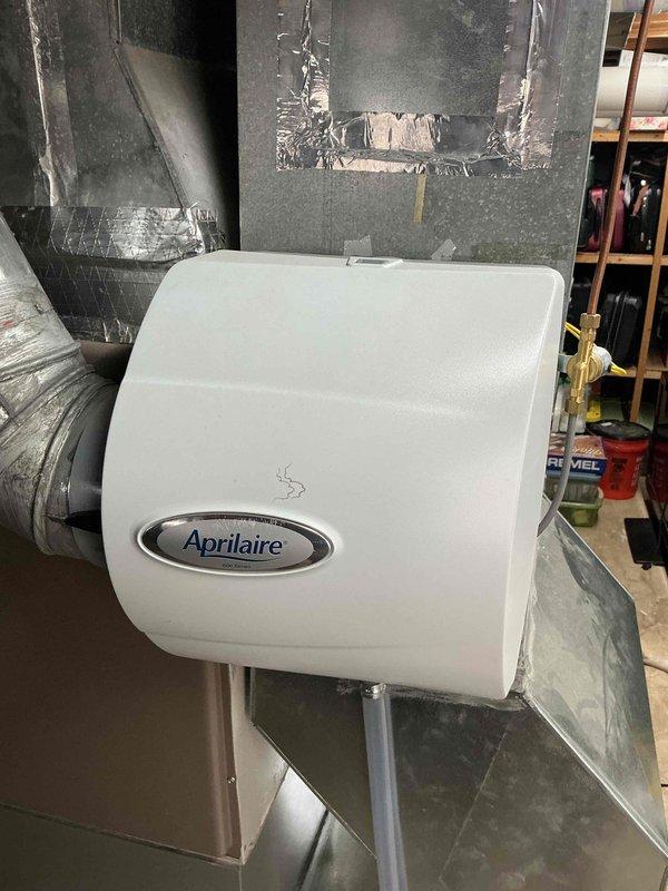 Performed a heating tune-up on a 4-year-old Lennox gas furnace with an attached Aprilaire whole-house humidifier, inspecting the furnace components, venting, ductwork connections, and humidifier water supply and drain lines. All equipment was found in good condition with no visible signs of leaks, corrosion, or ice, and the system was left operating properly.