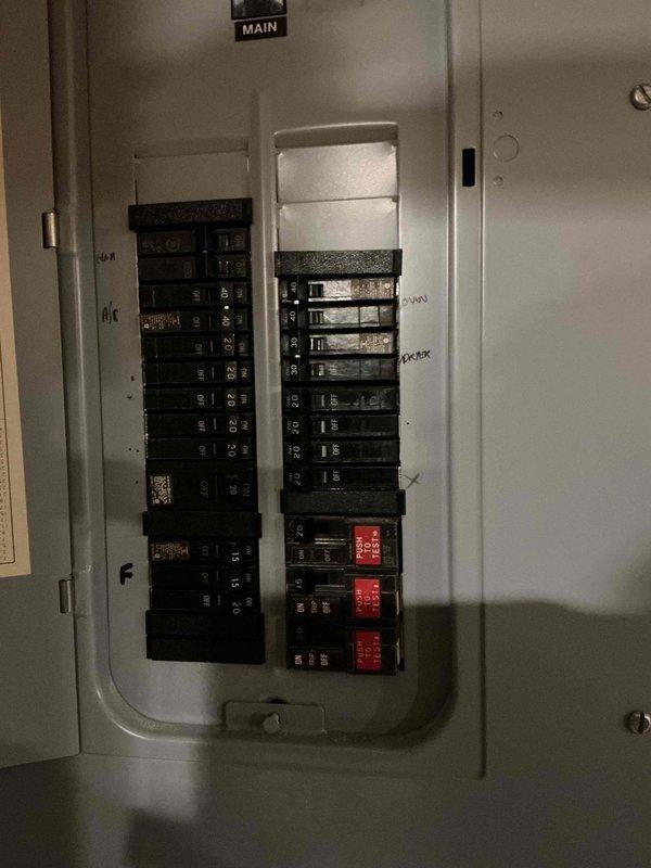 Conducted an on-site evaluation for installing an EV charger, inspecting the main electrical panel, which was found in good condition with no signs of rust or damage and with breaker slots and circuit labeling documented. Examined the overhead ceiling cavity to assess potential cable routing paths, noting existing wiring, junction boxes, and ductwork that will affect the run from the panel to the charger location. Findings were recorded to support a load assessment and installation estimate.