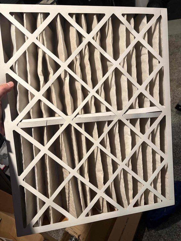 Performed a heating tune-up on a 7-year-old furnace and humidifier, inspecting the system components, ductwork, condensate piping, and refrigerant line connections, with no signs of damage, rust, or leaks observed. Evaluated the pleated air filter, which showed discoloration and uneven, compressed pleats indicating loading, and addressed it as part of the maintenance. System was left operating normally.