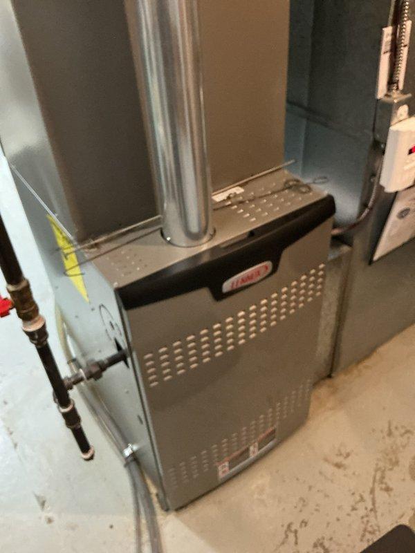 Performed a seasonal heating tune-up on a 5-year-old Lennox gas furnace that was operating properly at arrival. Inspected the furnace cabinet, flue venting, gas supply piping, shutoff valve, and thermostat controls, and found no signs of rust, frost, or visible damage. The system was left in good working order with no repairs required.