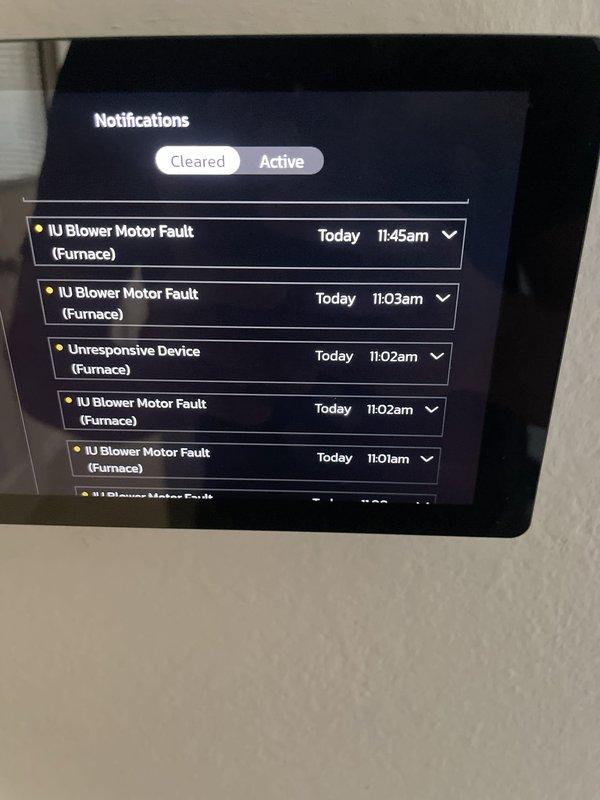 Responded to a no-cool call with the unit short cycling and failing to reach setpoint. Thermostat notification history showed repeated indoor unit blower motor faults and an unresponsive device alert on the furnace, indicating an air handler blower motor/communication issue causing the system to cycle prematurely. Documented the fault log with photos for warranty review under the unit's parts and labor coverage.