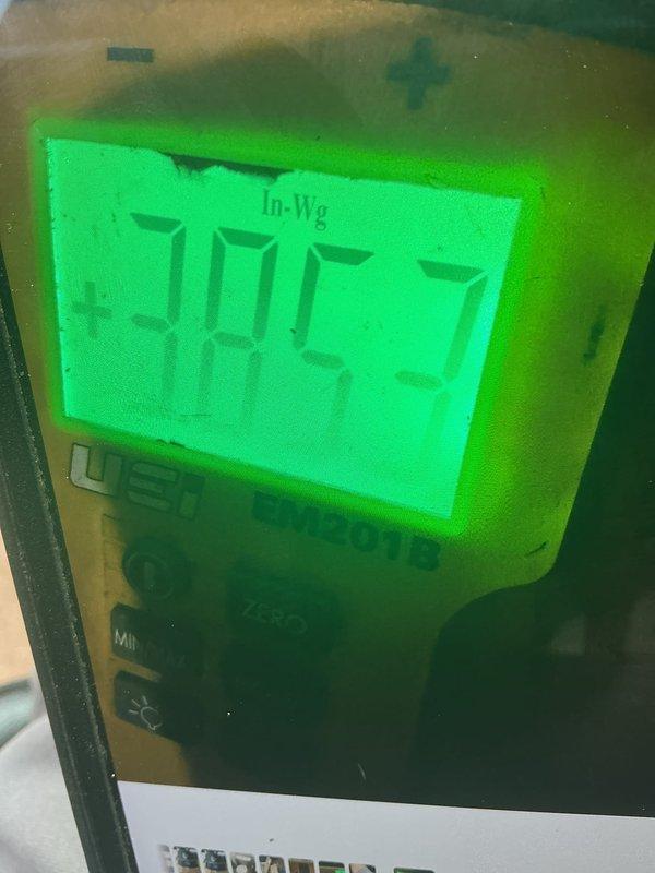 Returned to address a water heater pilot light repeatedly extinguishing. Inspected the installation in the utility area and performed draft/pressure testing with a digital manometer to evaluate venting and combustion air conditions as a potential cause of the pilot outage. Verified readings and system operation, and documented the findings with photos.