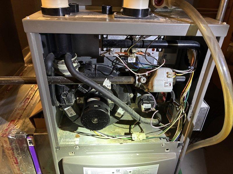 Performed routine heating tune-up on a 10+ year-old gas furnace and ductless unit, inspecting the burner assembly, gas valve, inducer motor, pressure switch, venting, and wiring connections. Found heavy rust and corrosion on the gas supply piping and fittings near the burner assembly, along with staining on the burner housing and a disconnected crimp terminal on a green wire; recommend further evaluation and repair of the corroded gas piping. System was operating properly at the time of service.