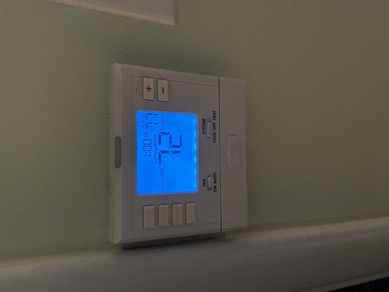 Performed a heating tune-up on one furnace, including electrical testing with a true-RMS clamp meter to verify amperage draw on the motor/control circuit, which measured approximately 2.07 A AC within normal operating range. Verified thermostat operation with the system switch set to heat and confirmed proper call for heat and calibration at a 72°F setpoint, with no abnormal conditions found. Unit operated normally at completion.