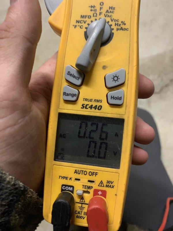 Performed a heating tune-up on a Lennox condensing gas furnace, inspecting the cabinet, PVC intake/exhaust venting, condensate drain line, and ductwork connections for proper installation and condition, with no visible rust, leaks, or damage. Measured blower motor amperage with a true RMS clamp meter, recording 0.26 A, and verified the unit was operating normally.