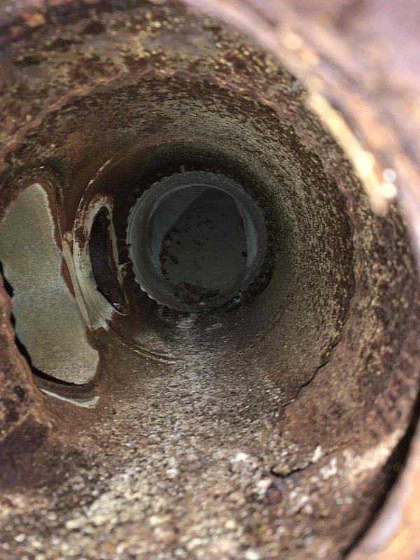 Responded to a no-heat call on a 9-year-old gas furnace that would not light. Inspection of the unit revealed a heavily corroded flue/vent passage with significant rust scale and mineral deposits, restricting proper venting and preventing safe ignition. The furnace was evaluated for combustion and venting safety, and repair or replacement of the deteriorated venting components is recommended to restore safe, reliable heating operation.