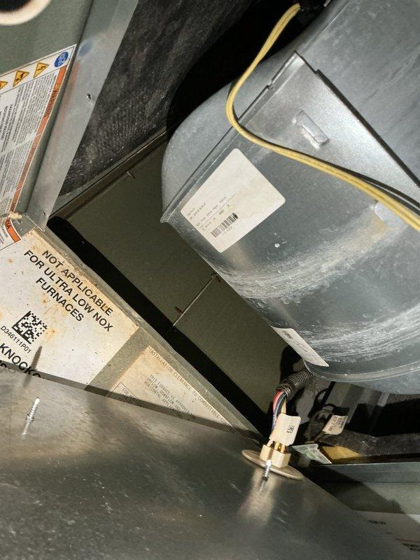 Responded to a water leak complaint on a single gas furnace and inspected the unit, finding standing water on the floor, rust staining at the vent and pressure switch tubing area, and mineral deposits on the blower housing, indicating condensate or moisture intrusion. Documented all affected components and conditions for evaluation of condensate drain, trap, and flue vent integrity.
