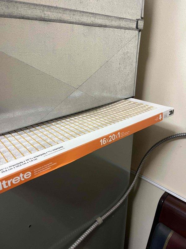 Performed a complete tune-up on one furnace, inspecting the control board and wiring, blower motor assembly, gas control valve, and burner assembly, and cleaning accumulated dust from the cabinet interior. Removed and replaced the 16x20x1 return air filter, verifying correct airflow direction, and confirmed the unit was operating properly at completion.