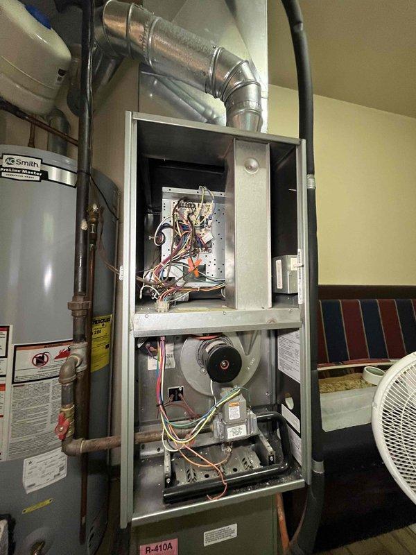 Performed a complete tune-up on one furnace, inspecting the control board and wiring, blower motor assembly, gas control valve, and burner assembly, and cleaning accumulated dust from the cabinet interior. Removed and replaced the 16x20x1 return air filter, verifying correct airflow direction, and confirmed the unit was operating properly at completion.