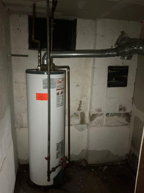 Removed the leaking gas tank-style water heater and converted the system to a tankless unit, including new gas, water, and venting connections. Disconnected and drained the old unit, installed and secured the tankless heater, then pressure-tested the connections, checked for gas leaks, and verified proper ignition and operation.