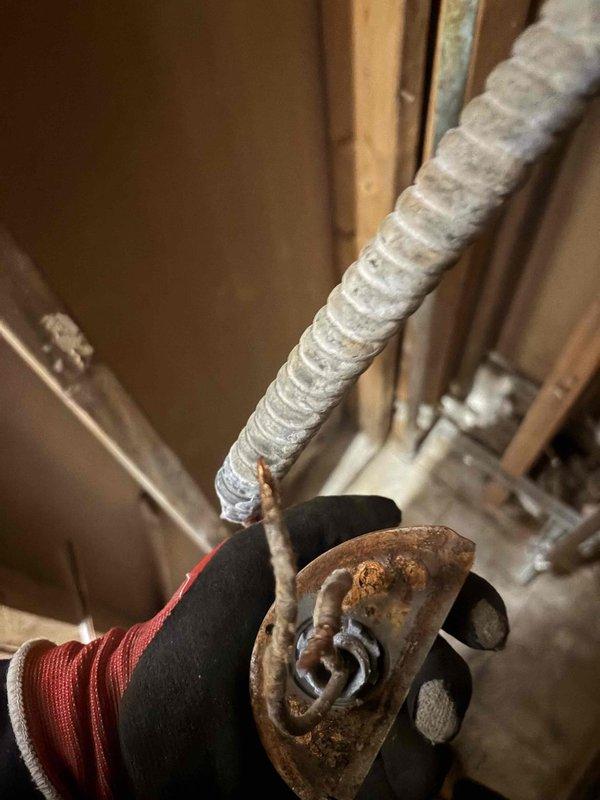 Removed and replaced the existing tanked water heater with a new 30-gallon lowboy blanketed electric unit under permit. Installed a 6' flexible conduit whip from the existing junction box behind the unit to make the electrical connection, and replaced a heavily corroded bracket found in the wall cavity. Completed all plumbing and electrical connections and verified proper operation.