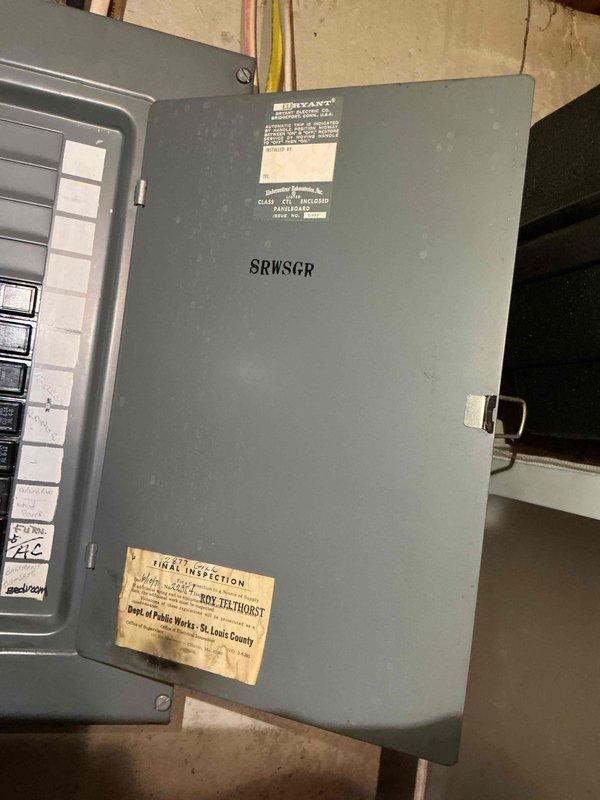 Responded to a bedroom outlet and switch malfunction by inspecting the residential electrical system, including the main breaker panel and associated branch circuits. Opened and evaluated the panel, noting dense, disorganized conductor routing, mixed-brand breakers (Bryant, Eaton, Square D), tandem breakers, and dirt and corrosion-related discoloration, and verified circuit labeling for the bedroom circuit. Documented panel conditions with photos and recommended further evaluation of the panel's condition and wiring.