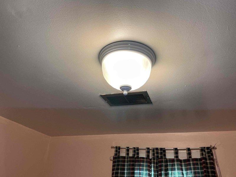 Returned to complete the scheduled light fixture installation. Removed the existing fixture, verified power was off, and installed the new flush-mount dome fixture with a frosted glass shade, securing it to the ceiling box and making the wire connections. Restored power and confirmed the fixture operates properly.