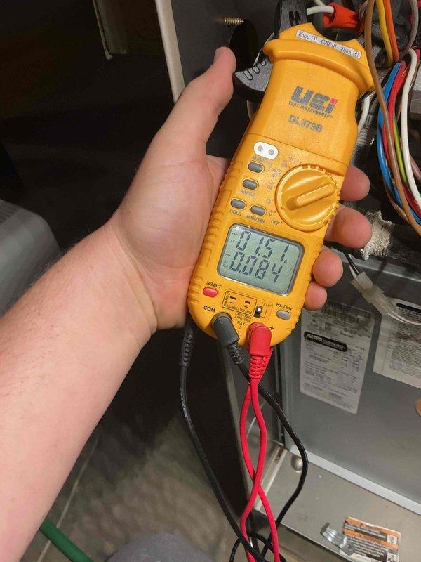 Performed a heating tune-up on a single furnace unit over 10 years old. Inspected the cabinet and interior components, replaced the air filter with a new 20x25x1 pleated filter to restore proper airflow, and used a clamp meter to measure electrical draw on the system's components. The system operated normally with no visible frost, rust, or damage observed.
