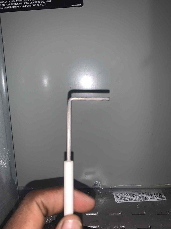 Performed a heating tune-up on one gas furnace, including inspection of the cabinet, flue vent connection, and burner/ignition components. Used an insulated probe to check internal components, and noted white mineral residue and debris on the unit's top panel, vent pipe, and cabinet edge, indicating possible condensation or moisture-related buildup that may warrant monitoring. Unit inspected and left operational.
