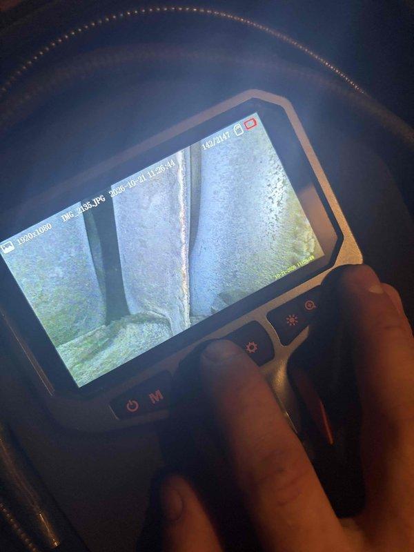 Performed a seasonal tune-up on one furnace, including a visual inspection of the heating system components. Used a borescope to inspect the interior of the flue/chimney, documenting the masonry condition, including a vertical seam or crack in the liner, surface deterioration, and moss/algae-type growth, as well as chalky mineral deposits that may indicate moisture or condensation exposure. Findings were documented with photos for review and recommendations.