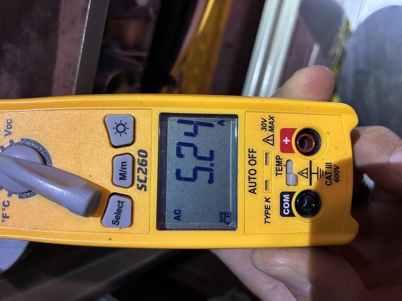 Performed a routine heating tune-up on a furnace approximately 10 years old, inspecting the system and verifying operation, with no specific problems or symptoms reported. Used a clamp meter to measure electrical current draw (approximately 5.24 A AC) to confirm components were operating within normal range, and noted service labeling and ductwork in satisfactory condition with no heavy rust or corrosion observed.