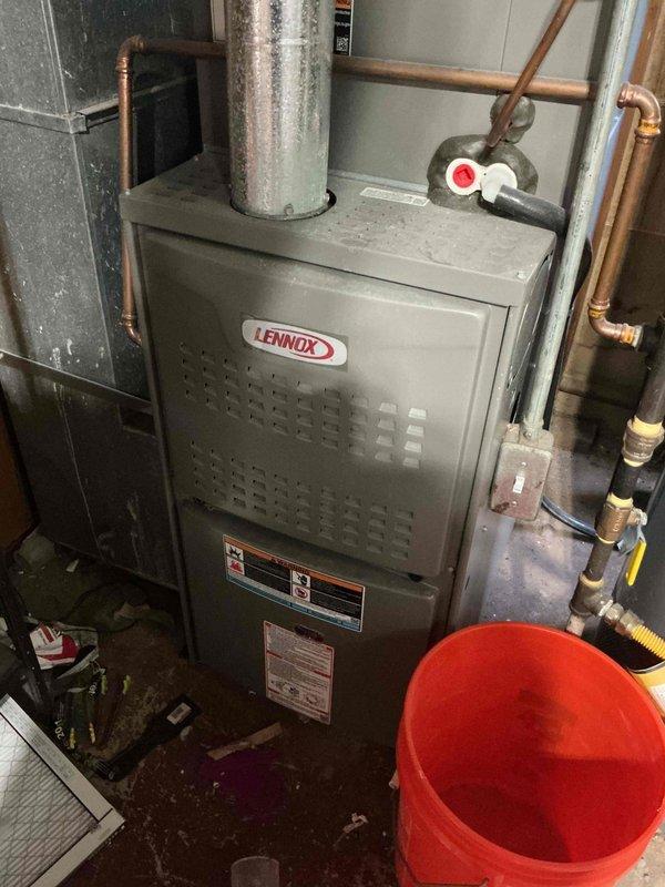 Performed a preventive maintenance tune-up on a Lennox gas furnace, including inspection of the burner assembly, flue pipe, gas line and shutoff valve, electrical connections, and condensate/drain components. Inspected and serviced the pleated return air filter, which showed dust loading, and confirmed proper airflow and system operation.