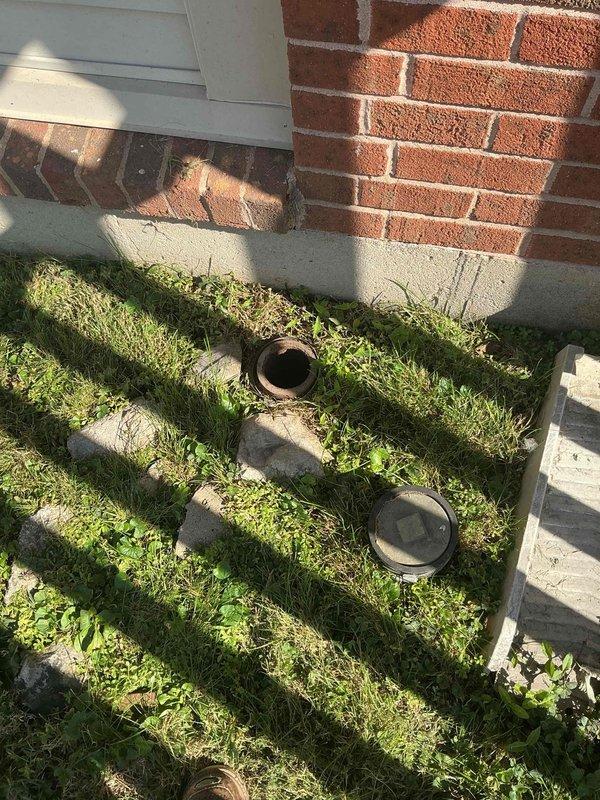 Accessed the 4" exterior cleanout, removed the cap, and hydro-jetted the main sewer line to clear obstructions and restore proper flow. Inspected the corroded cast iron cleanout opening, which showed heavy rust and scaling along the interior walls, and replaced the cap upon completion.