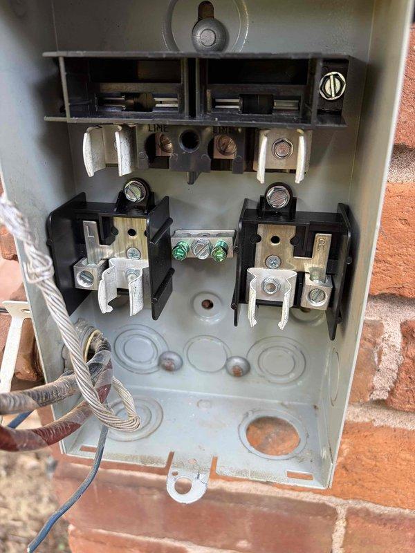 Replaced the 60-amp fuses in the outdoor electrical disconnect with two 40-amp cartridge fuses to properly match the equipment's circuit protection requirements. Verified secure connections at the line and load terminals, and removed the old components from the site.
