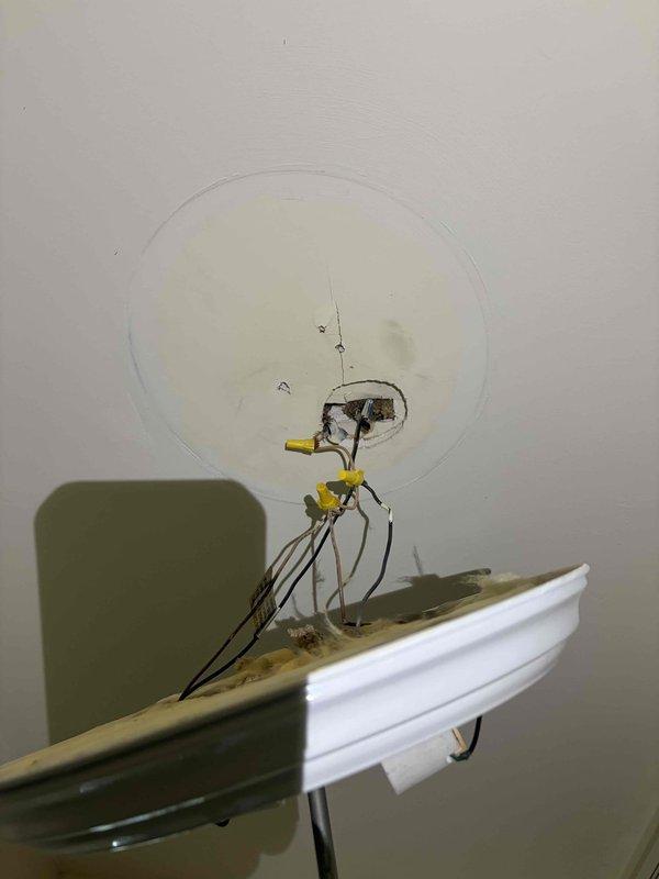 Responded to a blown fuse with partial power loss and inspected the affected circuit. A ceiling light fixture was found with deteriorated, brittle wire insulation and corrosion at the lamp socket, along with a tilted, loosely supported socket assembly, indicating a fault likely responsible for the overcurrent condition. The failed fixture was removed, conductors at the ceiling box were inspected and terminated with wire nuts, and the circuit was made safe pending replacement of the fixture and restoration of the fuse.