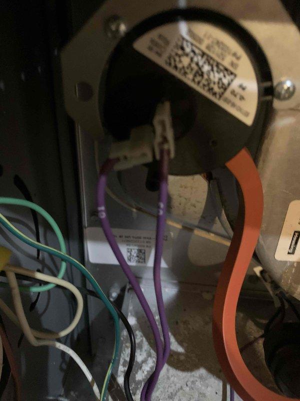 Responded to a no-heat call on an approximately 4-year-old Goodman furnace and inspected the cabinet, pressure switch, and related wiring and hose connections. Used a dual-port manometer to measure pressure at the pressure switch circuit, recording a negative pressure reading of -1.31 in. w.c., to evaluate draft inducer operation and verify proper switch function.
