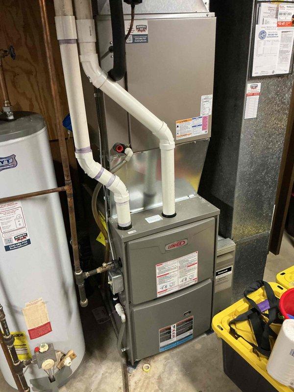 Performed a seasonal tune-up on a Lennox gas furnace (one unit), including a visual inspection of the cabinet, PVC intake/exhaust piping, gas line connections, and wiring, with no signs of rust, cracks, frost, or damage observed. Removed the burner access panel and serviced the flame sensor/igniter assembly, then verified safe and proper furnace operation.