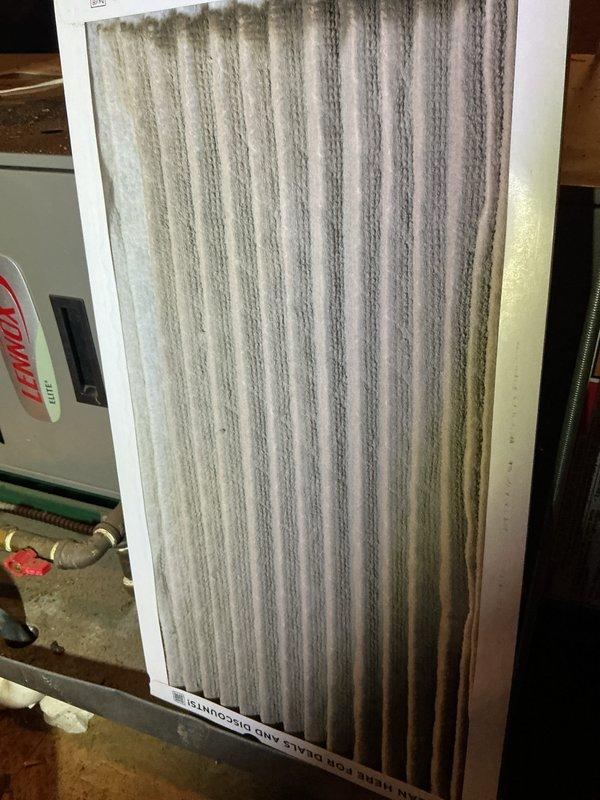 Performed heating tune-up on two 17-year-old Lennox gas furnaces. Inspected and replaced heavily loaded pleated air filters, and checked the burner compartments, where I found significant rust and corrosion on the burner tube ends and scale debris on the compartment floor and insulation block. Systems were operational at arrival; recommend further evaluation of burner and heat exchanger condition due to the corrosion observed.