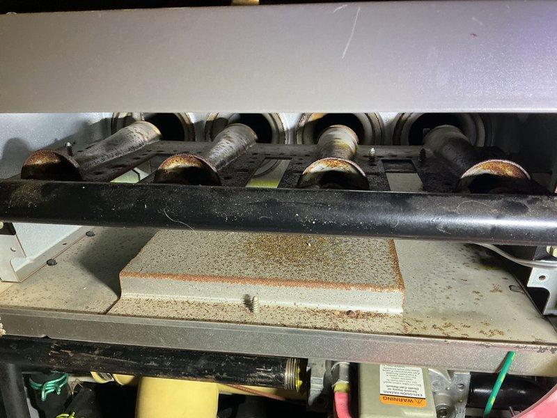 Performed heating tune-up on two 17-year-old Lennox gas furnaces. Inspected and replaced heavily loaded pleated air filters, and checked the burner compartments, where I found significant rust and corrosion on the burner tube ends and scale debris on the compartment floor and insulation block. Systems were operational at arrival; recommend further evaluation of burner and heat exchanger condition due to the corrosion observed.