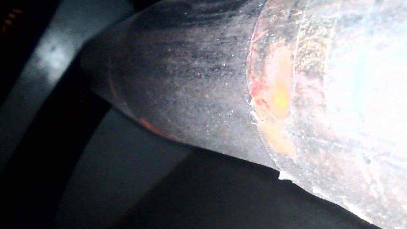Performed a heating tune-up on a single furnace, inspecting the heat exchanger and related components. Observed dusty, discolored coil surfaces with no breakage or frost, and noted corrosion and white mineral residue on a flue/venting pipe seam, which should be monitored or addressed to prevent further deterioration.