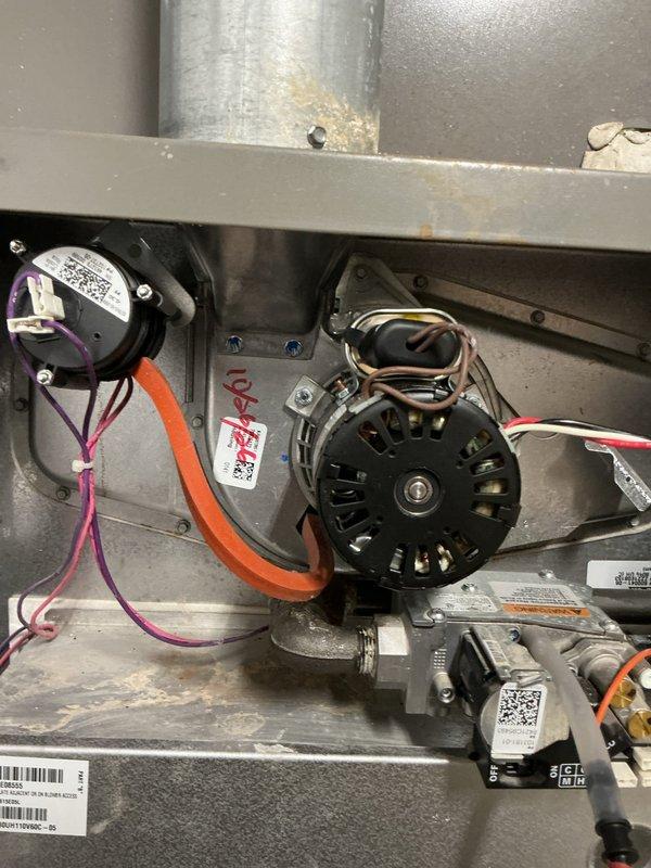 Replaced the failed draft inducer motor on the gas furnace and reconnected the wiring harness, pressure switch tubing, and flue connection. Verified proper inducer operation and pressure switch function with a digital manometer, and confirmed the furnace returned to normal heating operation. Removed the old motor from the site.