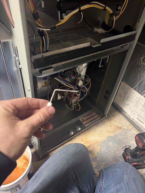 Performed a heating tune-up on one gas furnace, including removal of access panels and inspection of the burner compartment, control board, gas valve assembly, and wiring harness. Serviced the flame sensor/igniter assembly and removed the dirty, dust-loaded pleated air filter for replacement to restore proper airflow and combustion performance. Verified system components were in good condition and the unit was reassembled and ready for operation.