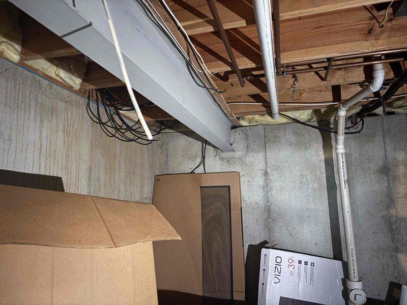 Performed an on-site assessment for a standby generator installation, including inspection of the natural gas service and meter assembly to evaluate fuel supply capacity and connection routing. Surveyed the basement to determine the electrical panel route, conduit and cable pathways, and potential transfer switch placement, noting exposed joists, existing cabling, and PVC piping to be coordinated around during installation.