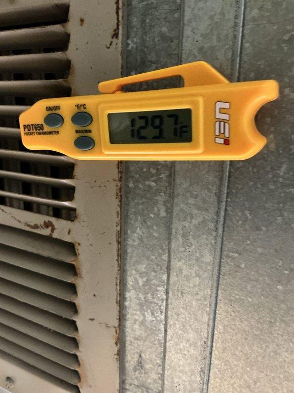 Performed a heating tune-up on one furnace, including inspection of the system and verification of operation. Measured supply and return air temperatures with a digital pocket thermometer, recording a supply air reading of 129.7°F and a return plenum reading of 74.1°F for a temperature rise of approximately 55.6°F, within normal operating range. Noted surface corrosion on the return grille and found the galvanized ductwork/plenum free of frost, rust, or visible damage.