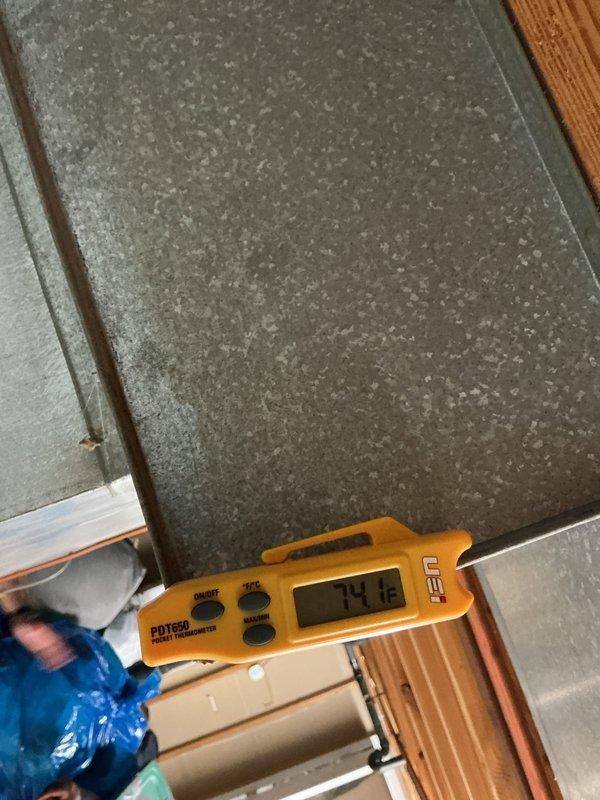 Performed a heating tune-up on one furnace, including inspection of the system and verification of operation. Measured supply and return air temperatures with a digital pocket thermometer, recording a supply air reading of 129.7°F and a return plenum reading of 74.1°F for a temperature rise of approximately 55.6°F, within normal operating range. Noted surface corrosion on the return grille and found the galvanized ductwork/plenum free of frost, rust, or visible damage.