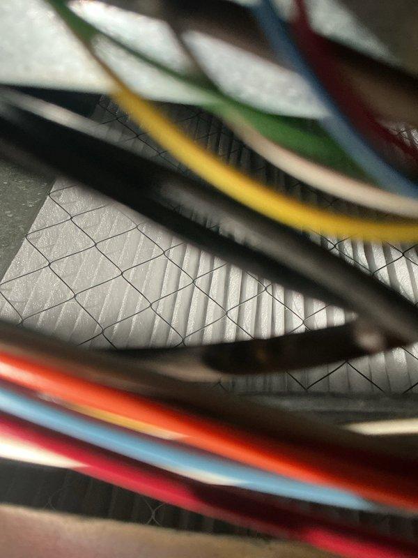 Performed a preventive heating tune-up on a 16-year-old gas furnace, inspecting the inducer motor assembly, flue piping, gas valve, burner and heat exchanger area, and control wiring with the access panel removed. Noted accumulated dust and grime on the internal components, and verified the wiring harnesses, connections, and air filter media were intact with no visible damage, rust, or other anomalies. The system was operating properly with no issues found at completion.