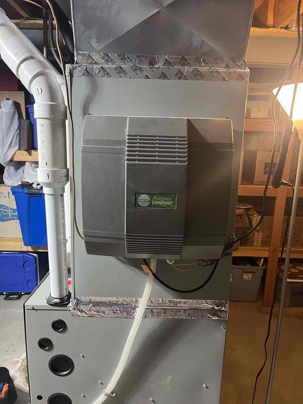 Performed a seasonal tune-up on the furnace and bypass-style whole-house humidifier, inspecting the unit, ductwork connections, condensate and humidifier drain lines, and wiring, and replacing the pleated media air filter. All components were found in good condition with no signs of rust, frost, leaks, or damage, and the system was left operating properly.