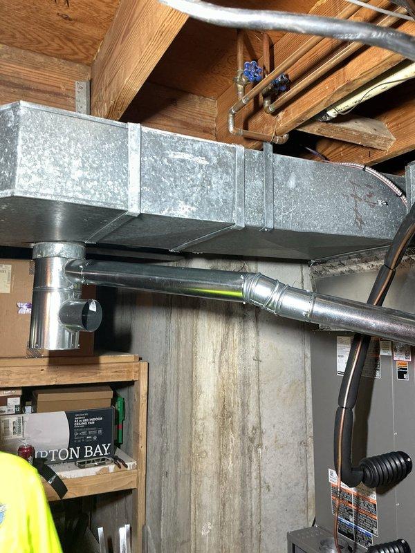 Installed a new 40-gallon tall gas tanked water heater, connecting the water supply and gas lines and venting the unit with 4" flue piping. Verified the installation is secure, leak-free, and operating properly, with the existing pressure-reducing valve and shutoff valves in the basement utility space left in place.