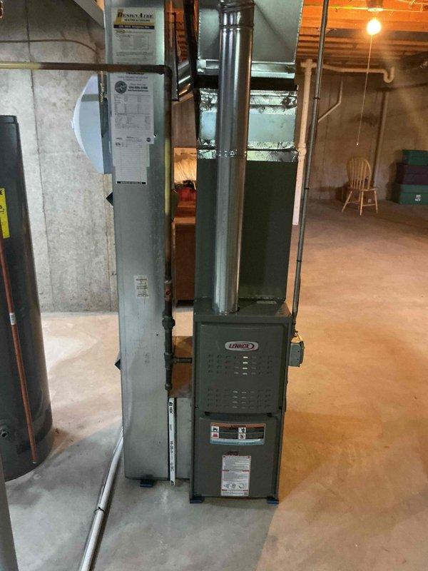 Performed a heating maintenance visit on a Lennox gas furnace (under 10 years old), inspecting the unit, flue venting, gas piping, and surrounding ductwork with no signs of rust, frost, or damage observed. Removed the dirty, dust-laden 16x25x1 pleated air filter for replacement and completed the furnace tune-up, then installed a humidifier on the system as requested.