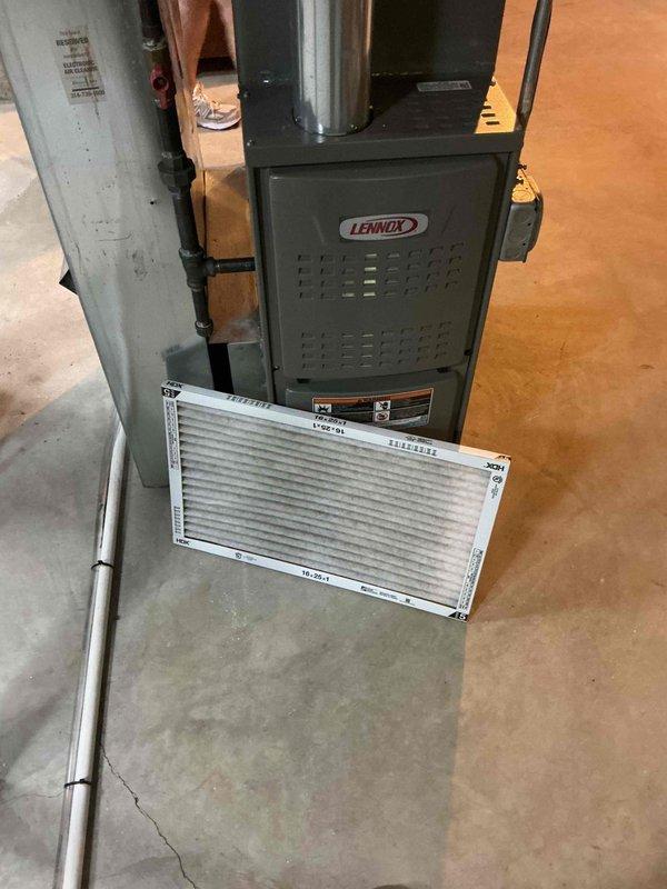 Performed a heating maintenance visit on a Lennox gas furnace (under 10 years old), inspecting the unit, flue venting, gas piping, and surrounding ductwork with no signs of rust, frost, or damage observed. Removed the dirty, dust-laden 16x25x1 pleated air filter for replacement and completed the furnace tune-up, then installed a humidifier on the system as requested.