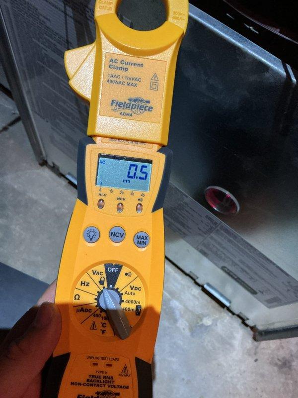 Performed a heating tune-up on a 14-year-old furnace, including electrical testing with a true RMS clamp meter to measure component amperage draw and verification of ambient temperature with a digital pocket thermometer. Inspected the furnace control board and wiring connections, confirming the status indicator was operating normally and the system was functioning properly.
